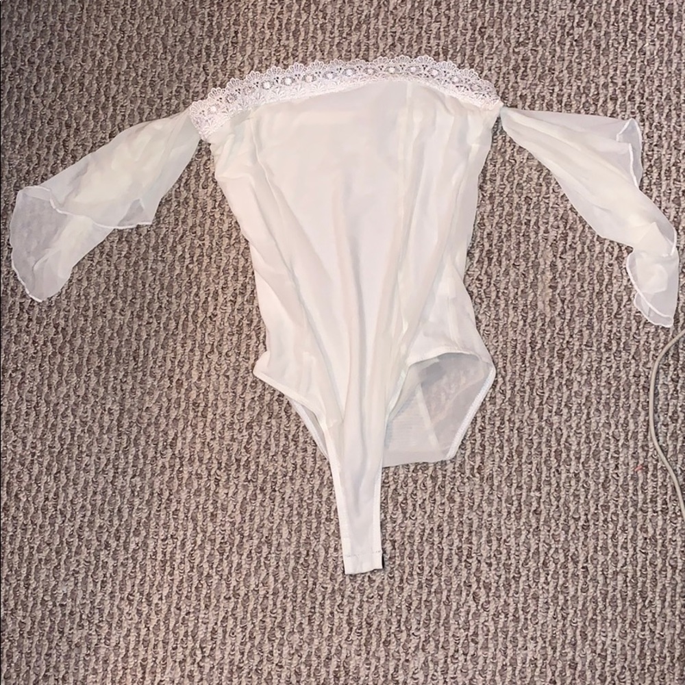 Cream colored off the shoulder body suit